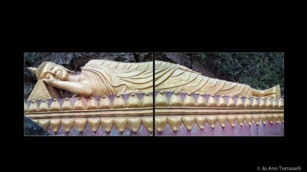 A large statue of a  gold reclining Buddha diptych on black background
